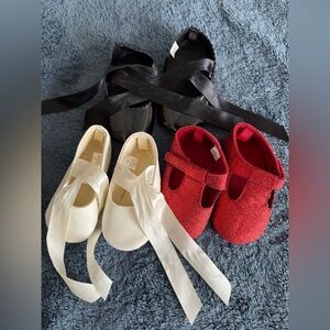 Bundle of three baby shoes in white black and red